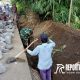 Gotong royong pelebaran jalan rabat beton sepanjang 650 meter di Dusun Tumpeng Timur RT.02/RW.03, Desa Tumpeng, Kecamatan Candipuro, Kabupaten Lumajang.